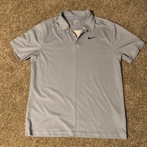Medium light blue Nike golf shirt.